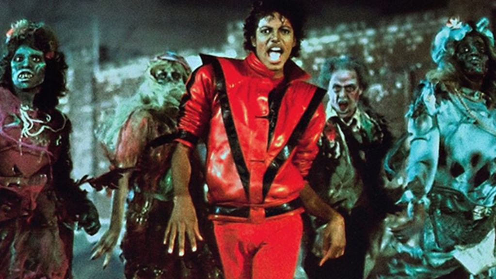Michael Jackson wearing a red jacket with black accents in the Thriller music video.