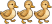 Three duckling are walking.